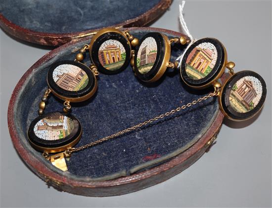 An early 20th century gilt metal and oval micro mosaic panel set bracelet.